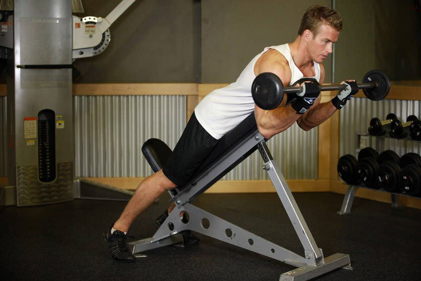 Barbell Curls Lying Against An Incline