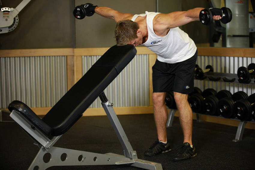 Bent Over Dumbbell Rear Delt Raise With Head On Bench